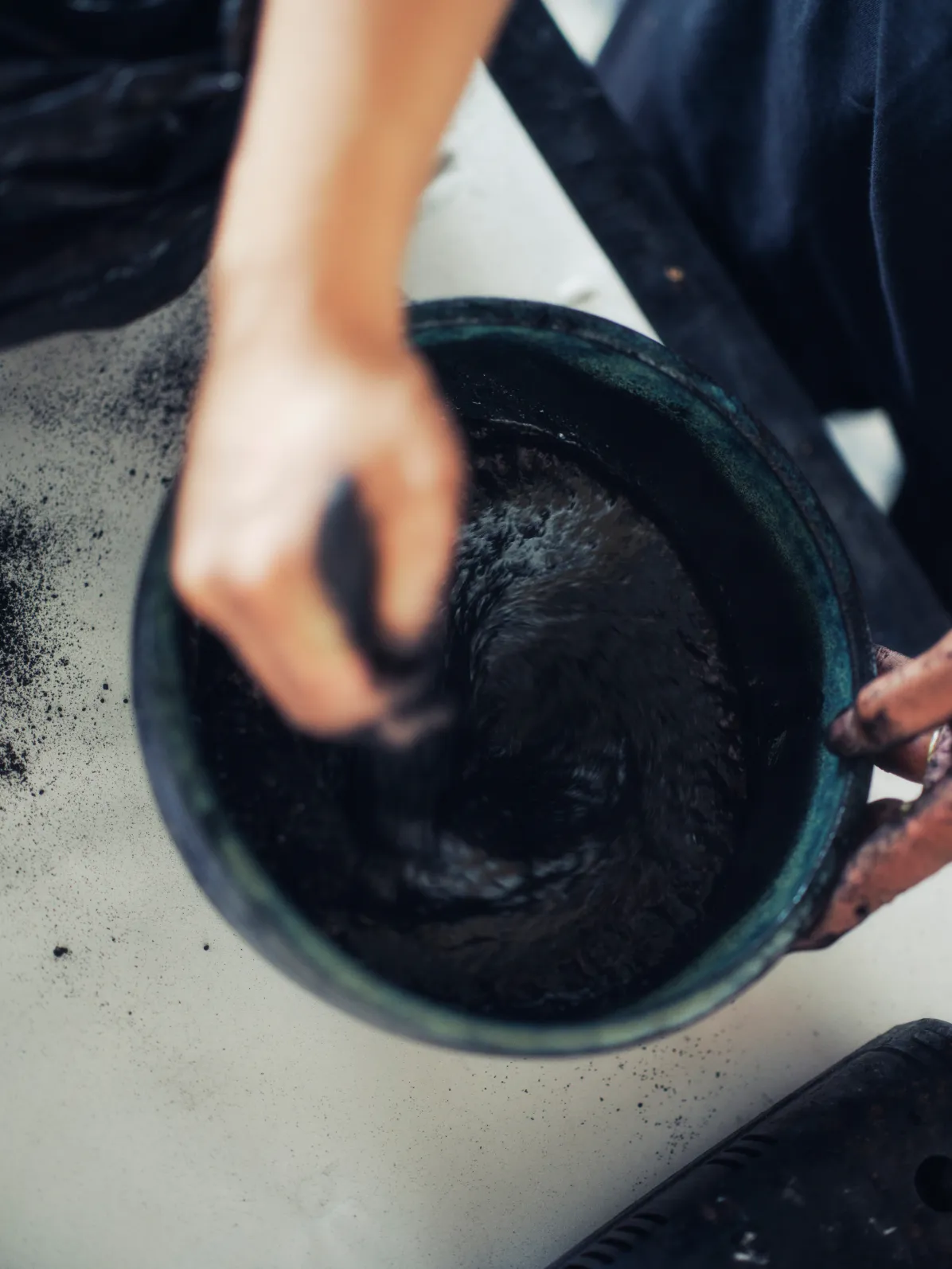 Calligrapher Daichiro Shinjo preparing ink